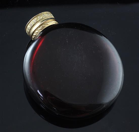 A 19ct century gold topped moon shaped ruby glass scent bottle, 3.25in.